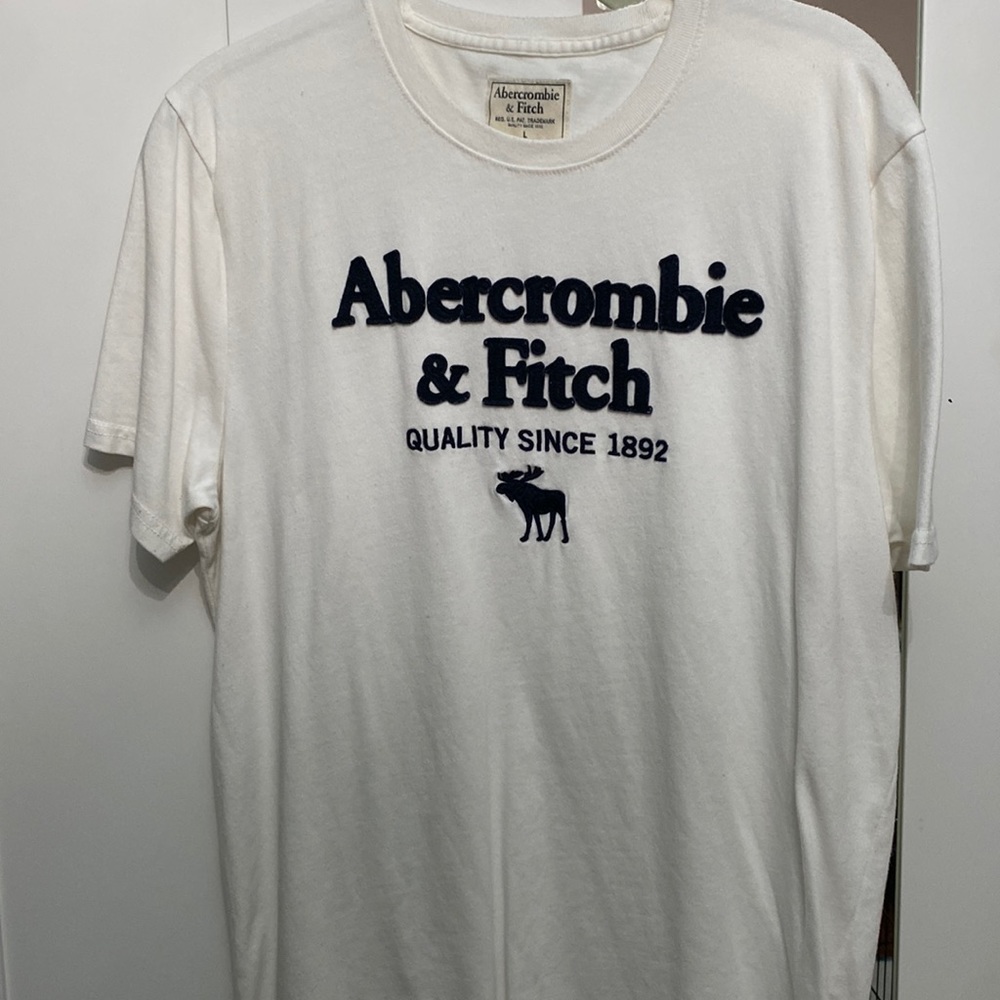 Women’s large tee, white and dark blue lettering, perfect for an any day shirt.